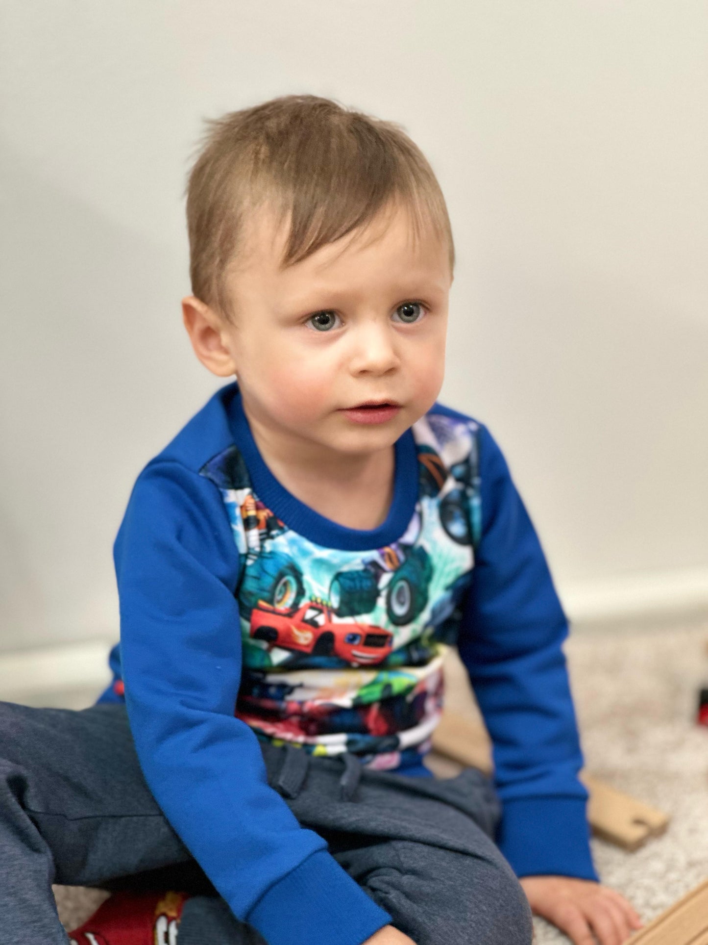 Blue sweater with cars